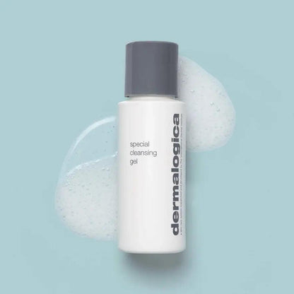 Dermalogica Special Cleansing Gel bottle with foaming cleanser on a blue background.