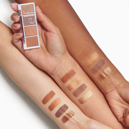 e.l.f. Bite Size Eyeshadows Pumpkin Pie compact held above swatches on diverse skin tones showcasing matte and shimmer shades.