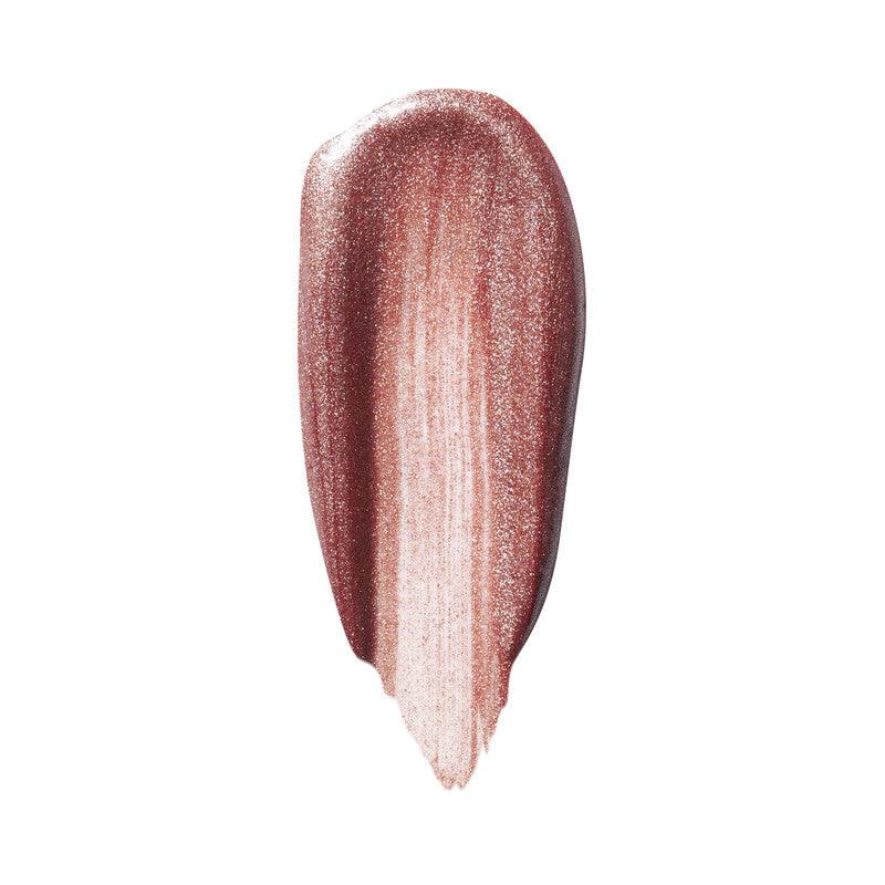 Swatch of e.l.f Halo Glow Blush Beauty Wand in a shimmering rose shade, showcasing its radiant color and creamy texture.