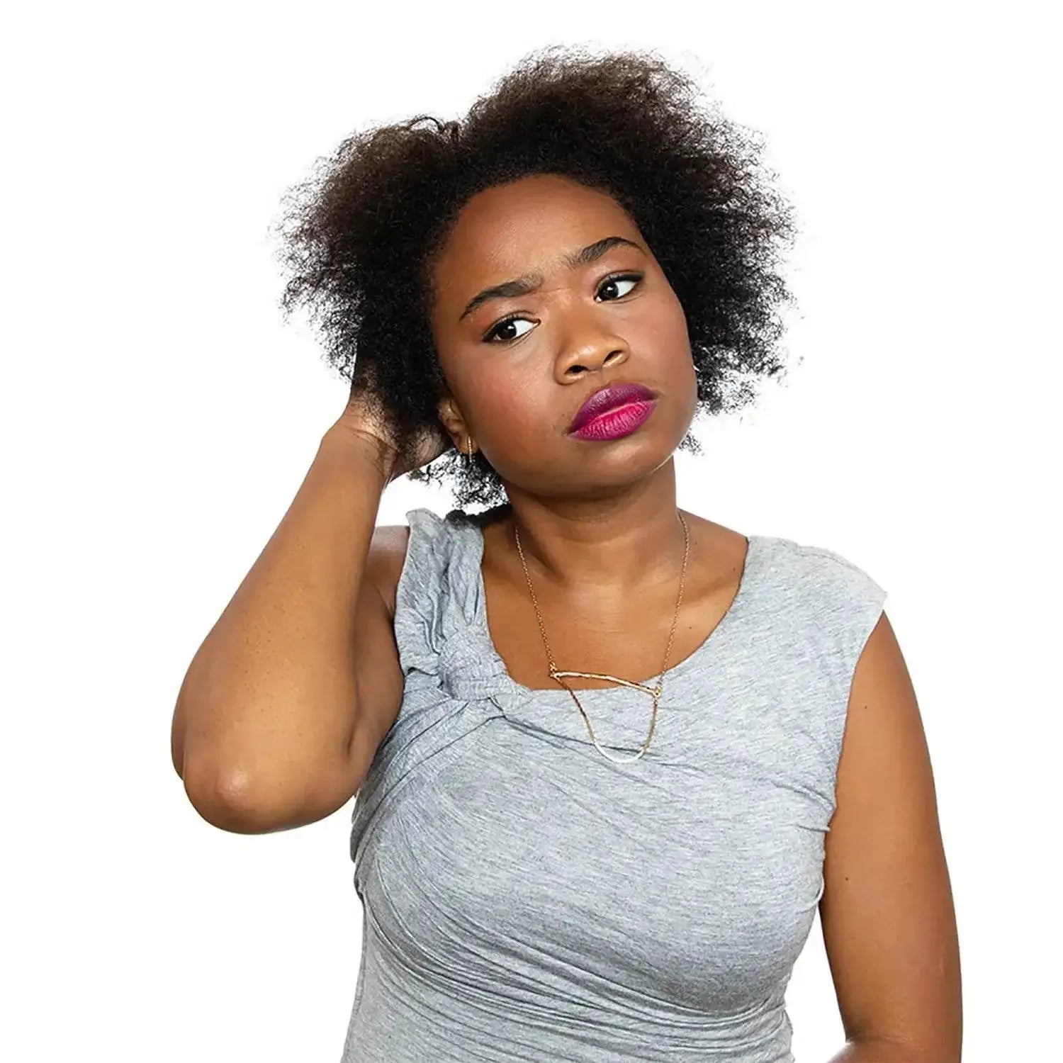 Model showcasing hair with natural texture and a concerned expression, promoting K18 Leave-In Molecular Repair Hair Mask.