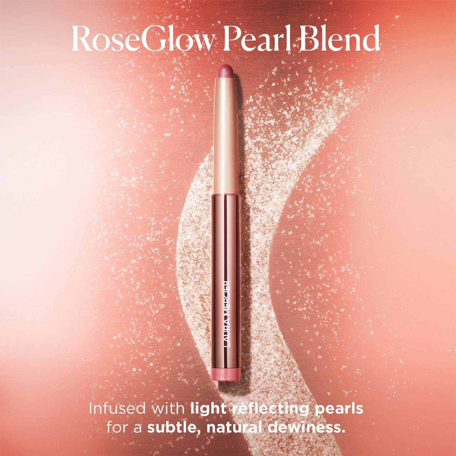 Laura Mercier RoseGlow Pearl-Blend pen on a rose backdrop, showcasing light-reflecting pearls for natural dewiness.