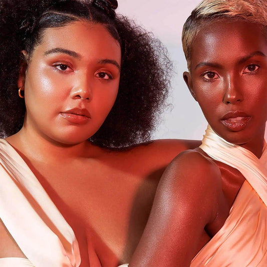 Two diverse models showcasing the Live Tinted Hueglow - DAWN highlighter, radiating a luminous complexion.