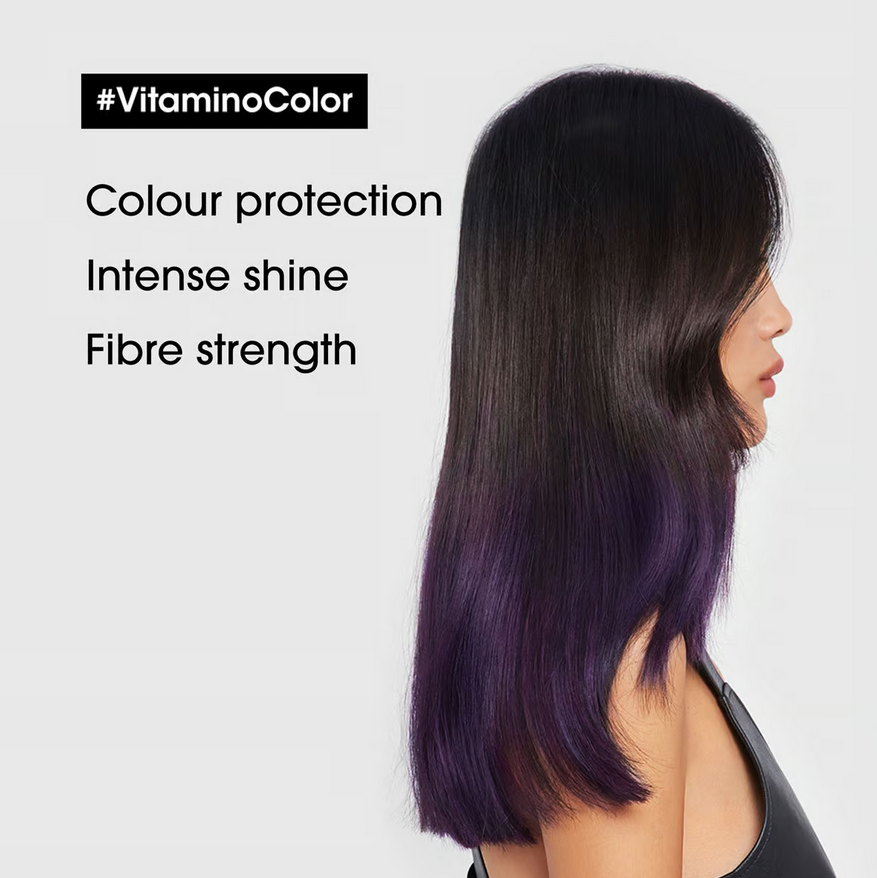 Model showcasing shiny, vibrant hair highlighting L'Oreal Vitamino Color benefits: colour protection and fibre strength.