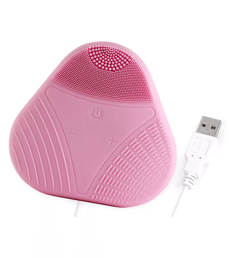 Magnitone XOXO SoftTouch Silicone Cleansing Brush in pink with USB charger, ideal for gentle skincare.