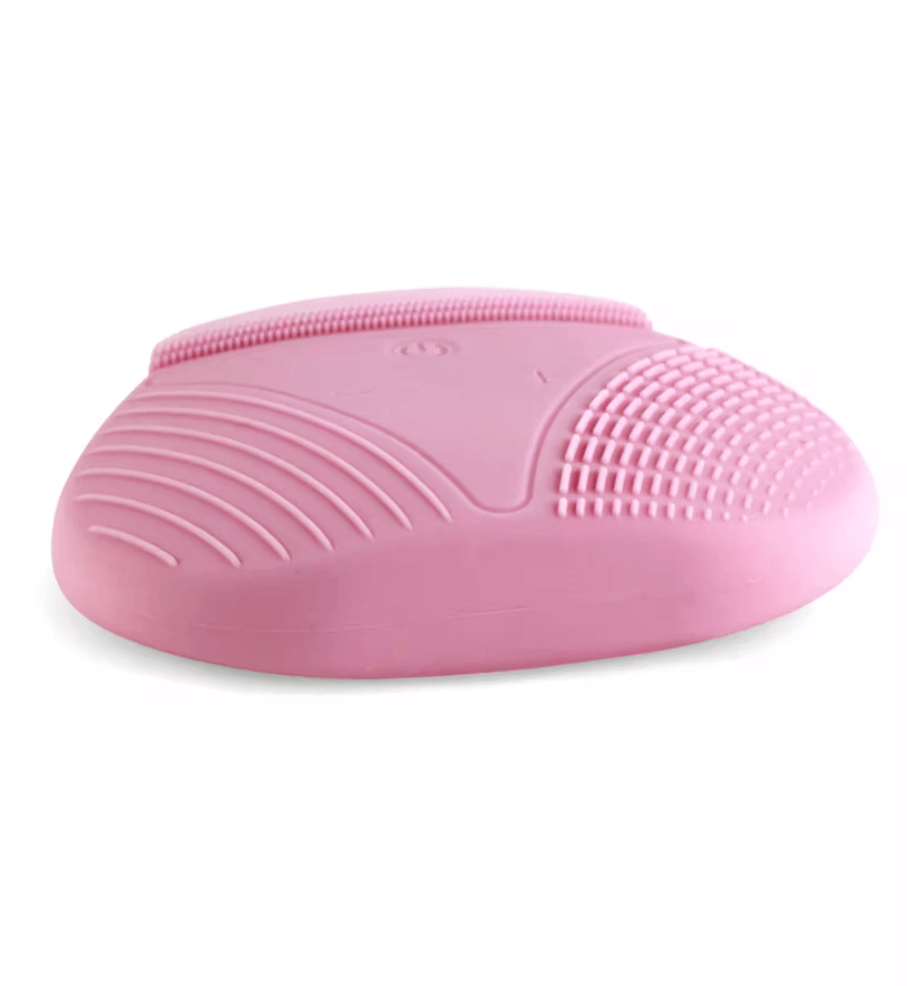 Pink Magnitone XOXO SoftTouch Silicone Cleansing Brush designed for gentle deep cleansing and skincare.