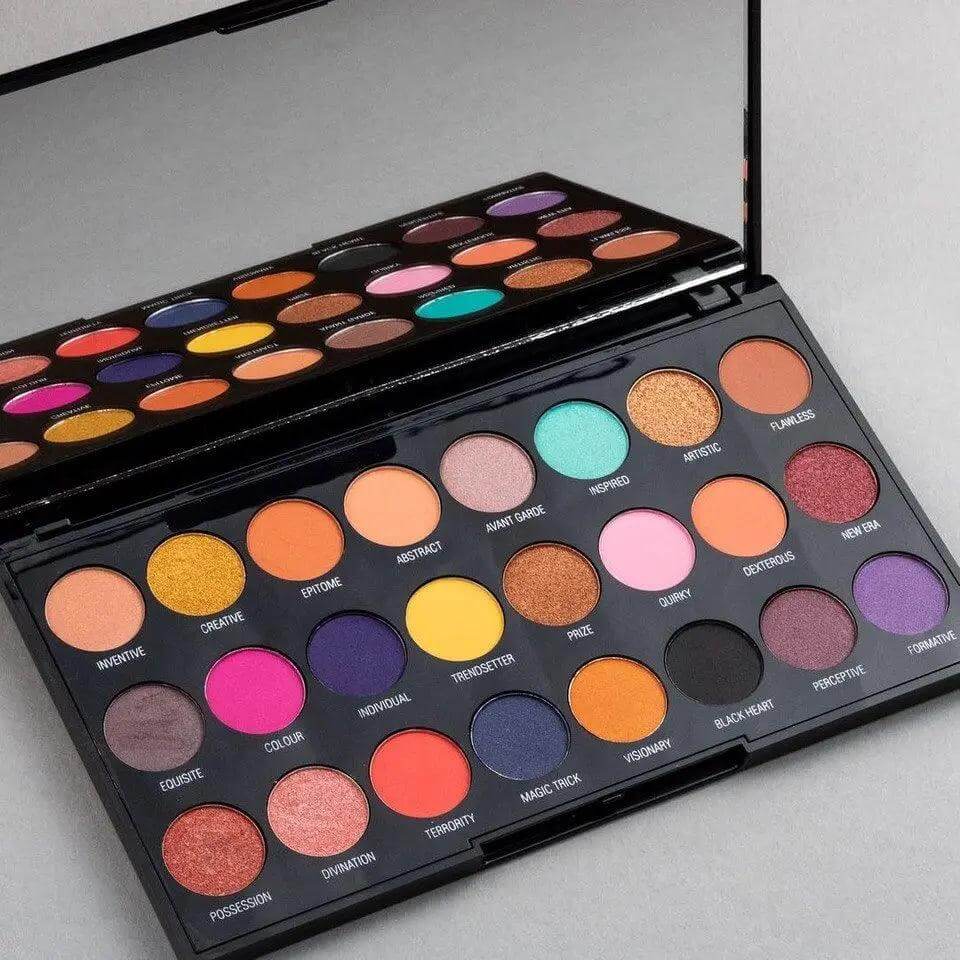 Makeup Revolution Creative Vol 1 Palette with 24 vibrant eyeshadows in bold brights, shimmers, and mattes.