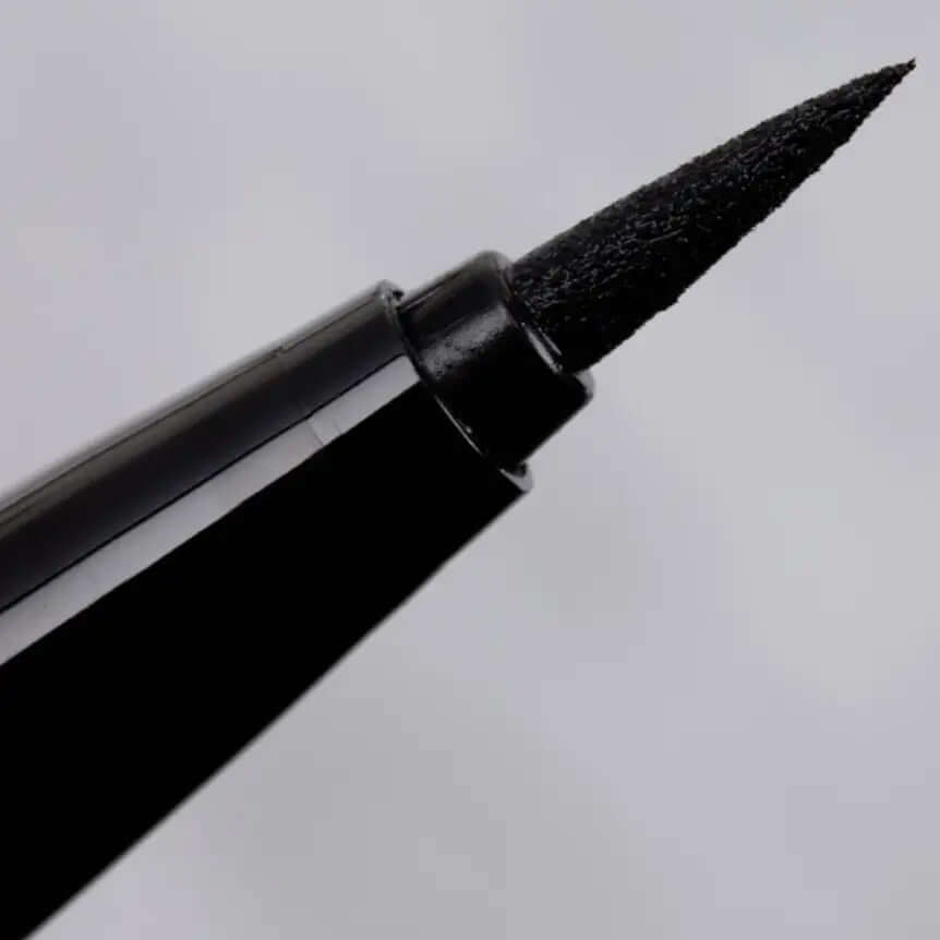 Close-up of Natasha Denona Macro Blade Liquid Liner applicator tip for precise, dark black eyeliner application.