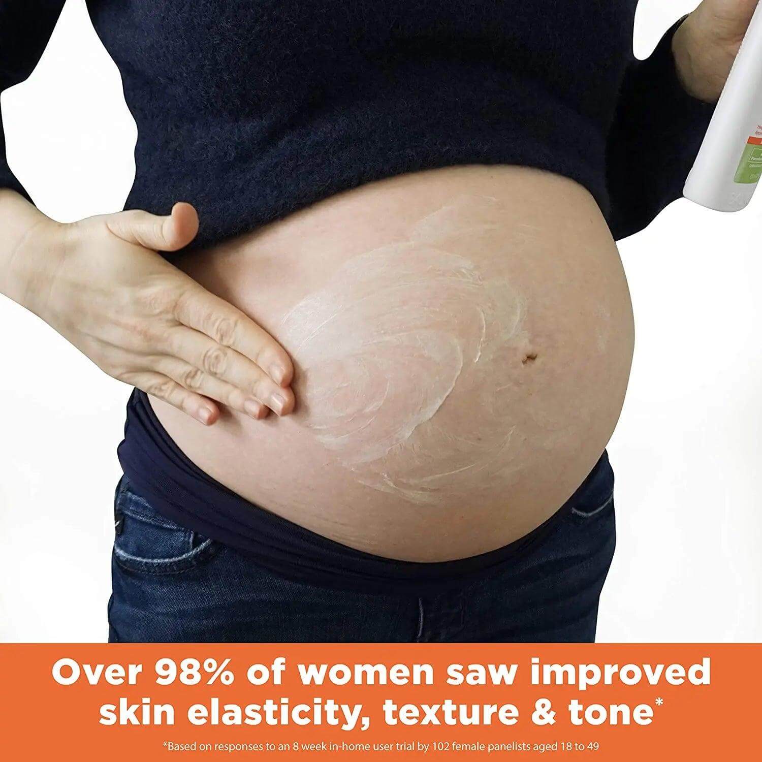 Pregnant woman applying Palmer's Cocoa Butter Stretch Mark Lotion for improved skin elasticity and tone.