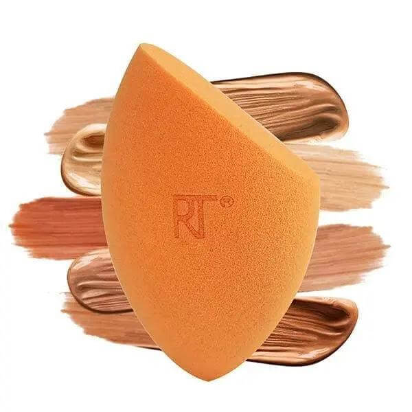 Real Techniques Miracle Complexion Sponge in orange with makeup swatches for even blending and flawless finish.