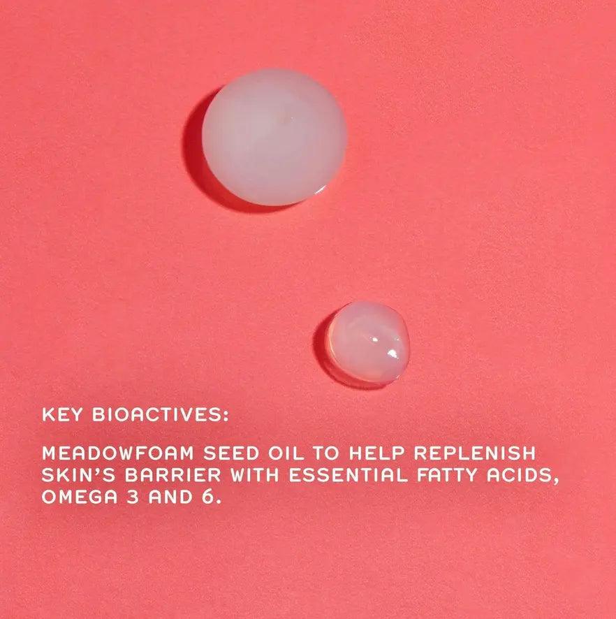 Ren Meadowfoam seed oil droplets on a pink background to highlight skincare bioactives for skin barrier support.
