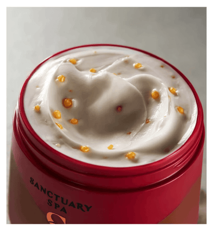 Sanctuary Spa Ruby Oud Body Butter showing creamy texture with golden encapsulated pearls for hydration.