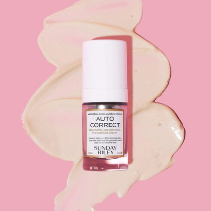 Sunday Riley Autocorrect Brightening and Depuffing Eye Contour Cream on a soft pink background, showcasing its luxurious formula.