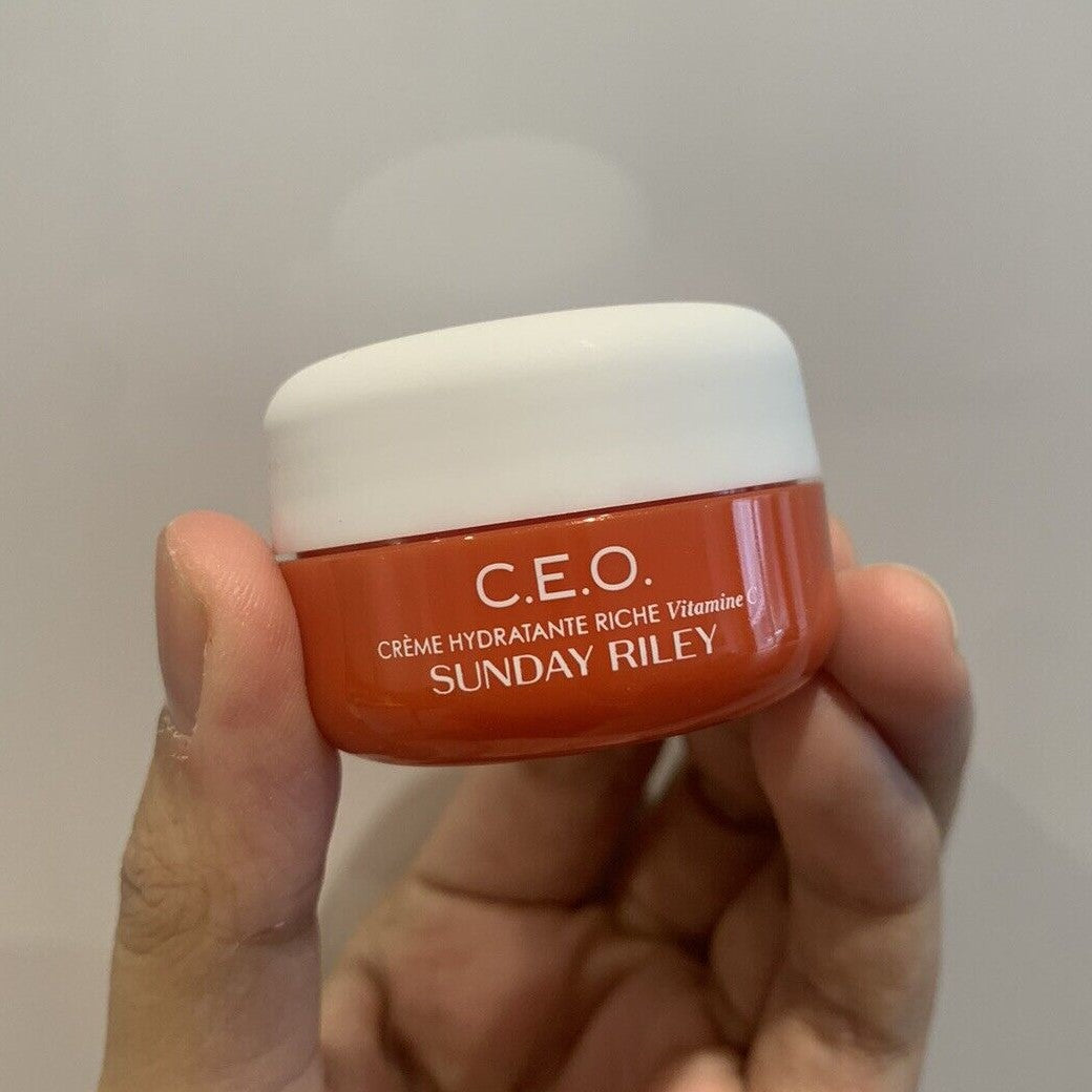 Sunday Riley C.E.O. Vitamin C Rich Hydration Cream 15ml in hand, showcasing its moisturizing qualities.
