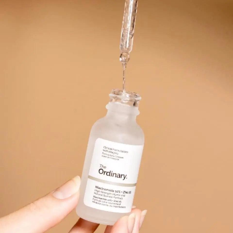 The Ordinary Niacinamide 10% + Zinc 1% serum in a glass dropper bottle, promoting clearer, radiant skin.