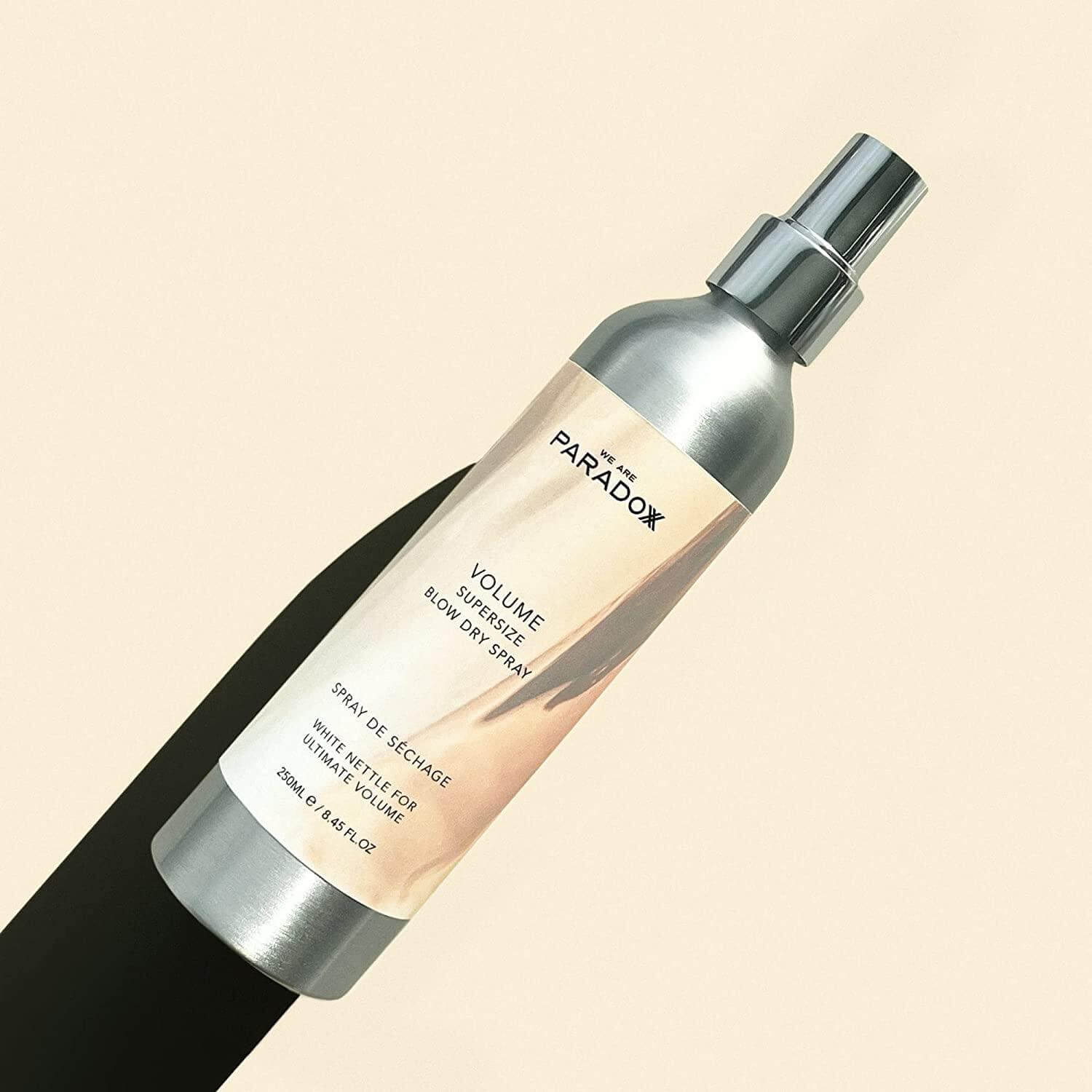 We Are Paradoxx Volume Supersize Blow Dry Spray 250ml for voluminous hair and glossy finish.