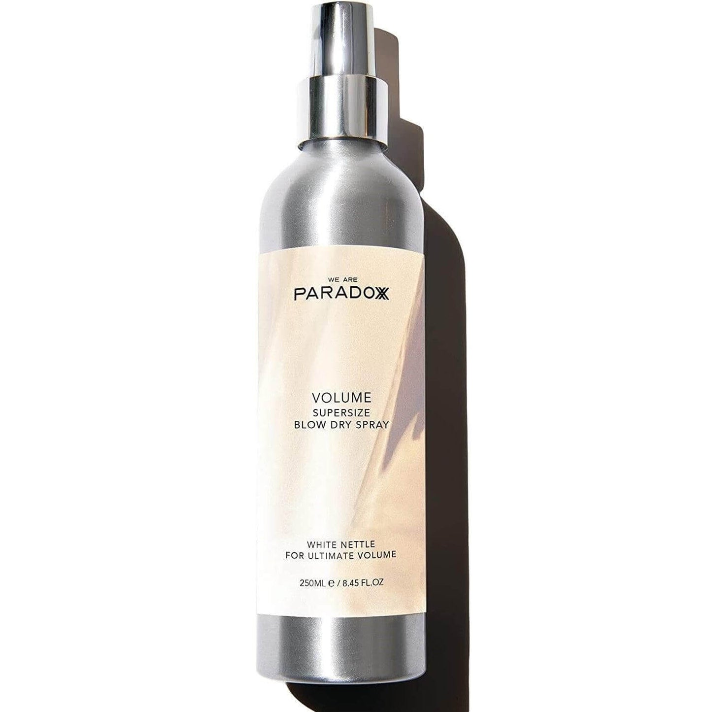 We Are Paradoxx Volume Supersize Blow Dry Spray bottle, 250ml, for instant lift and voluminous hair.